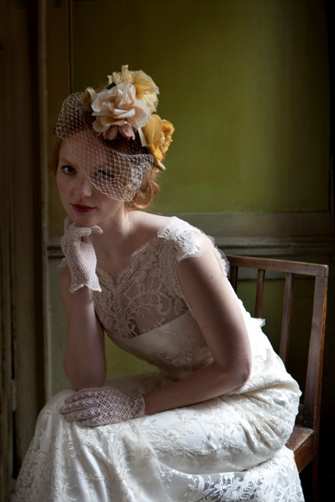 Floral headpiece with vintage millinery flowers and detachable birdcage veil, Cherished. Dress, Emmeline by Sally Lacock. Photographic credit: Jeff Cottenden. 