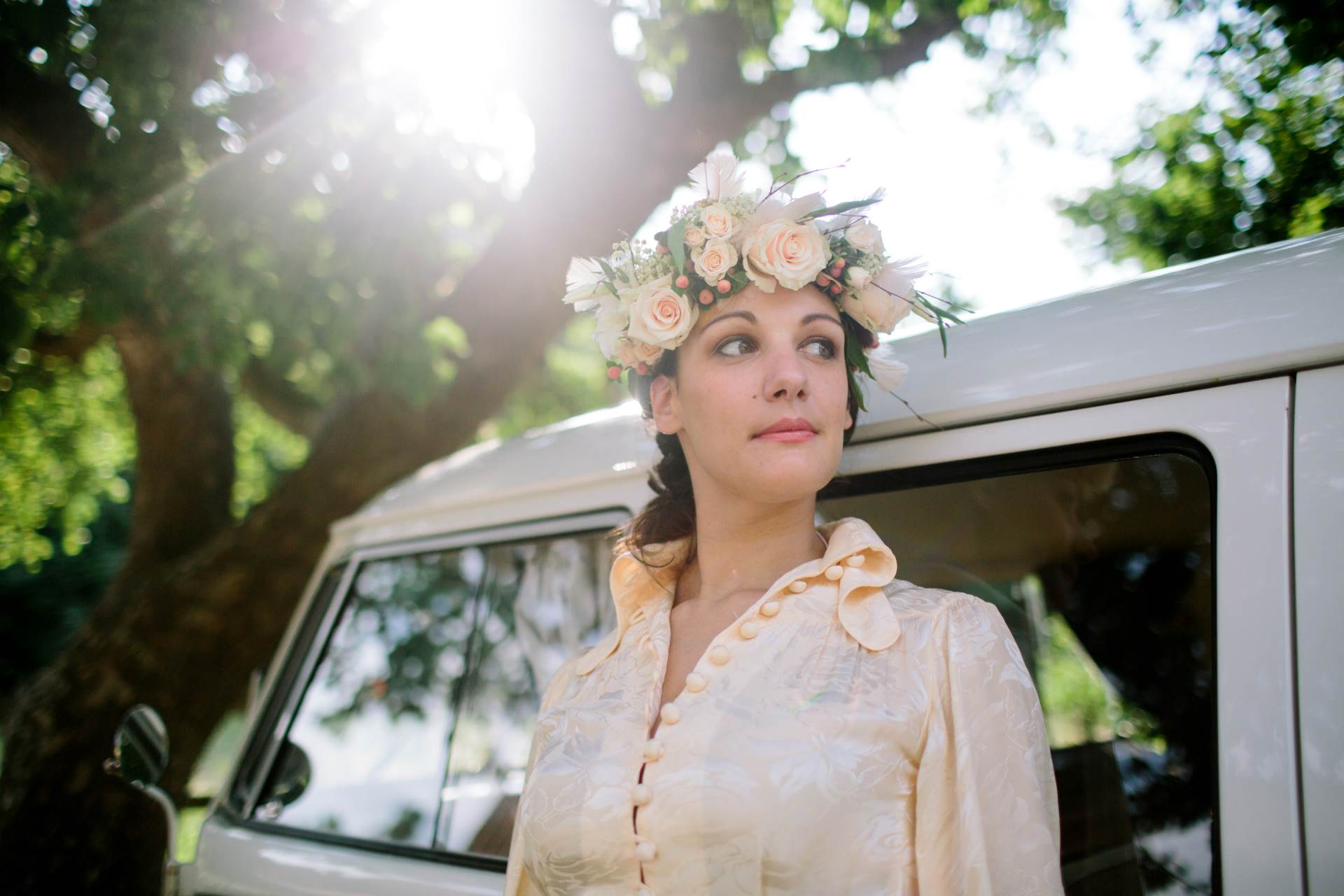 1970s vintage wedding boho bride with camper van and flower crown photo by Binky Nixon for the National Vintage Wedding Fair