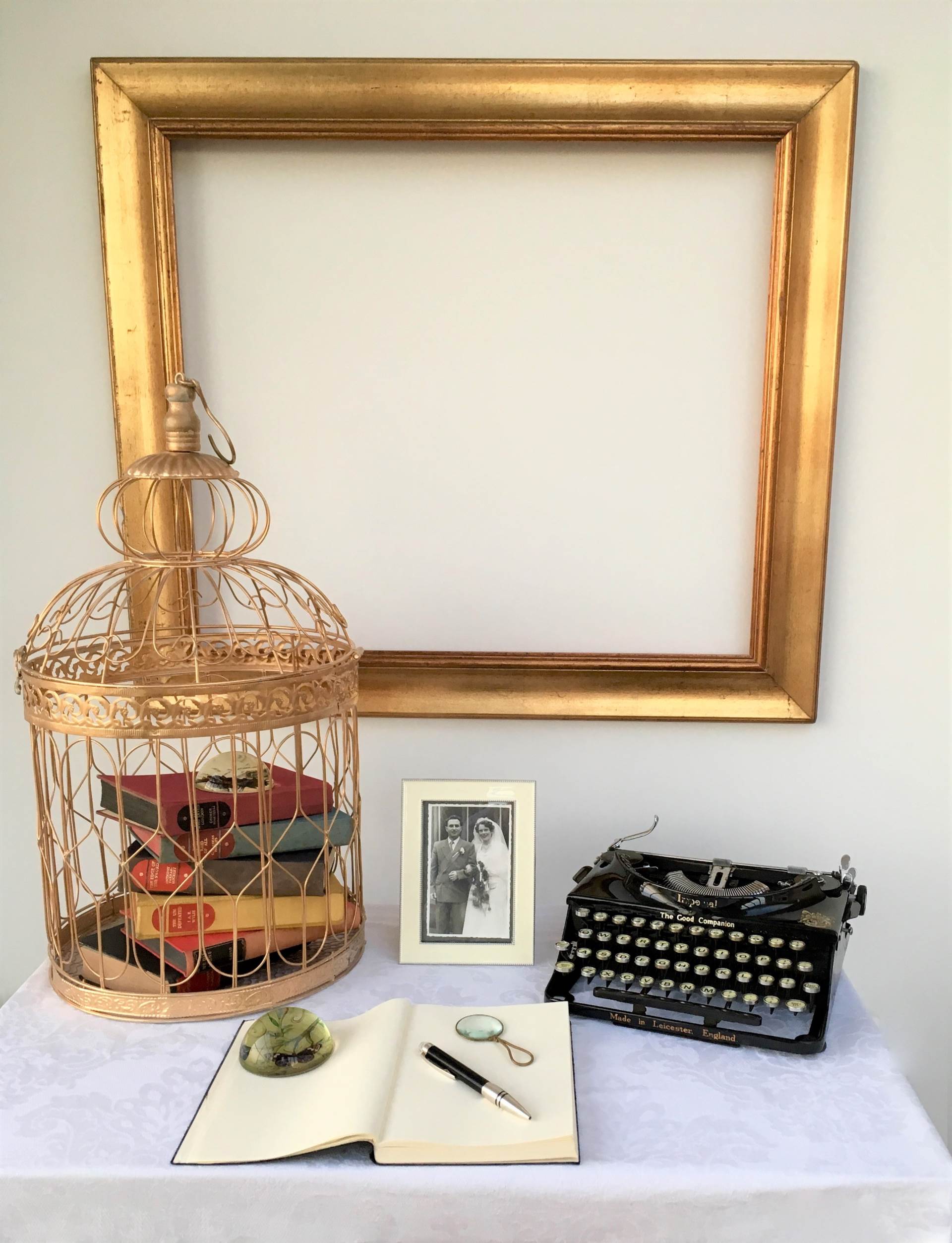 Styling ideas for a vintage wedding using suitcases for a guest book table