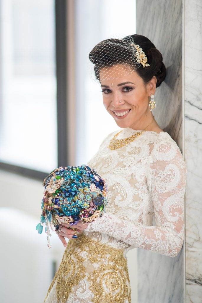 An American real wedding with a brooch bouquet and a couture dress