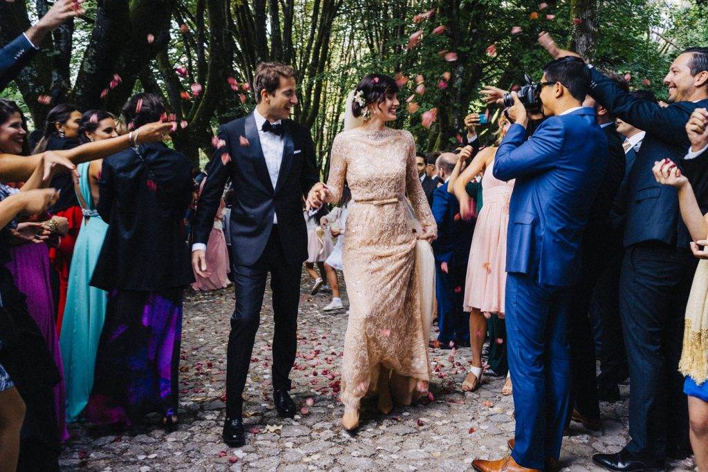 A magical Portuguese wedding with a pink lace dress & silk flowers