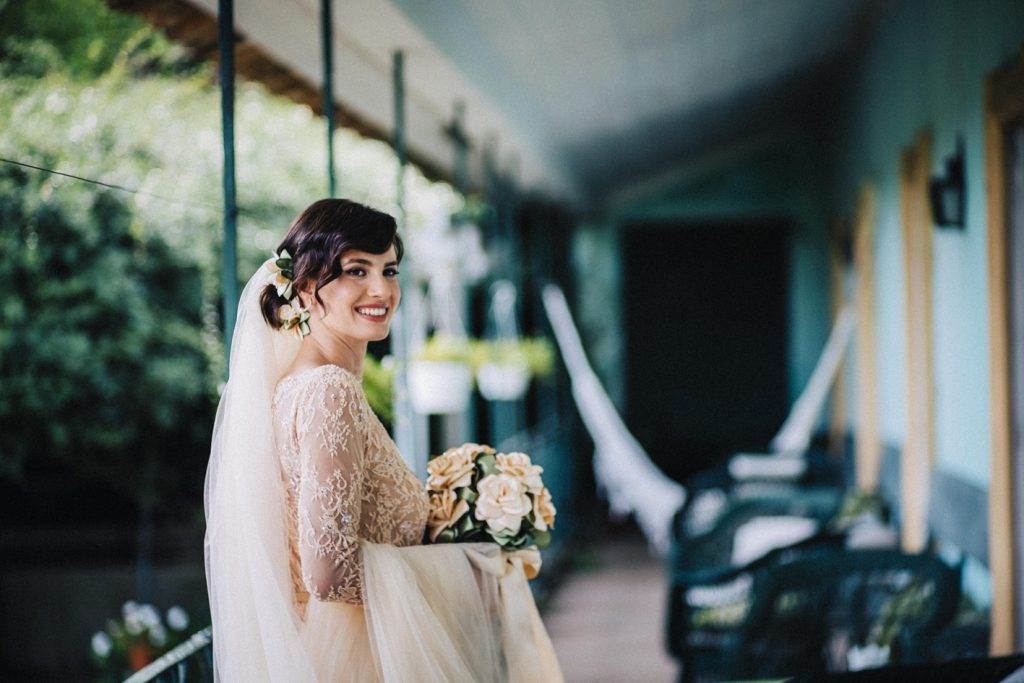 A magical Portuguese wedding with a pink lace dress & silk flowers