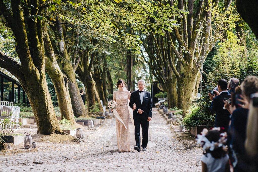 A magical Portuguese wedding with a pink lace dress & silk flowers