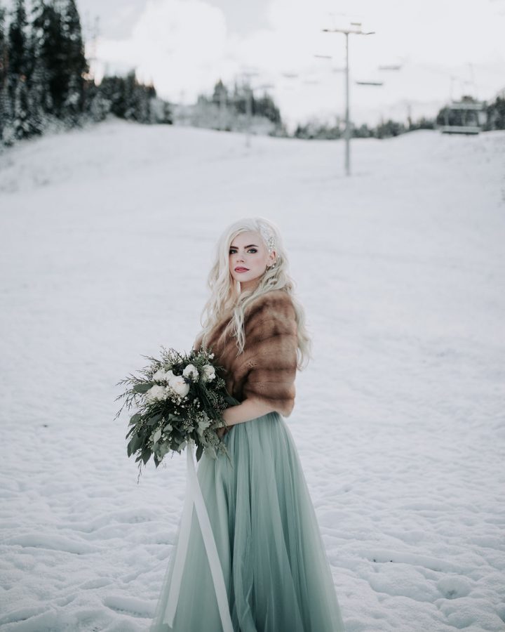 Winter Wonderland Wedding with Blue Wedding Dress and Fur Capelet