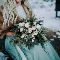 Winter Wonderland Wedding with Blue Wedding Dress and Fur Capelet