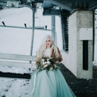 Winter Wonderland Wedding with Blue Wedding Dress and Fur Capelet