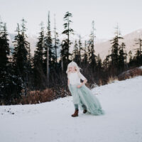 Winter Wonderland Wedding with Blue Wedding Dress and Fur Capelet