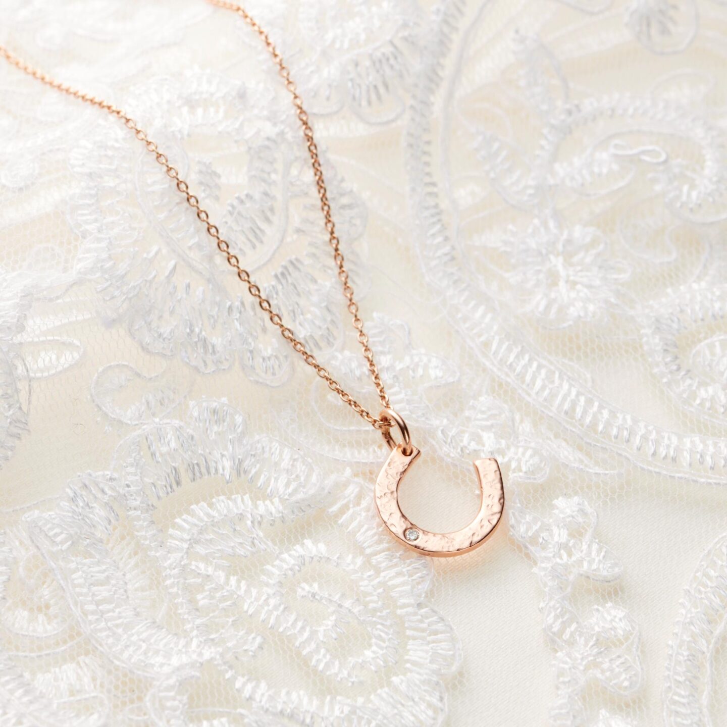 Rose gold and diamond birthstone horseshoe necklace